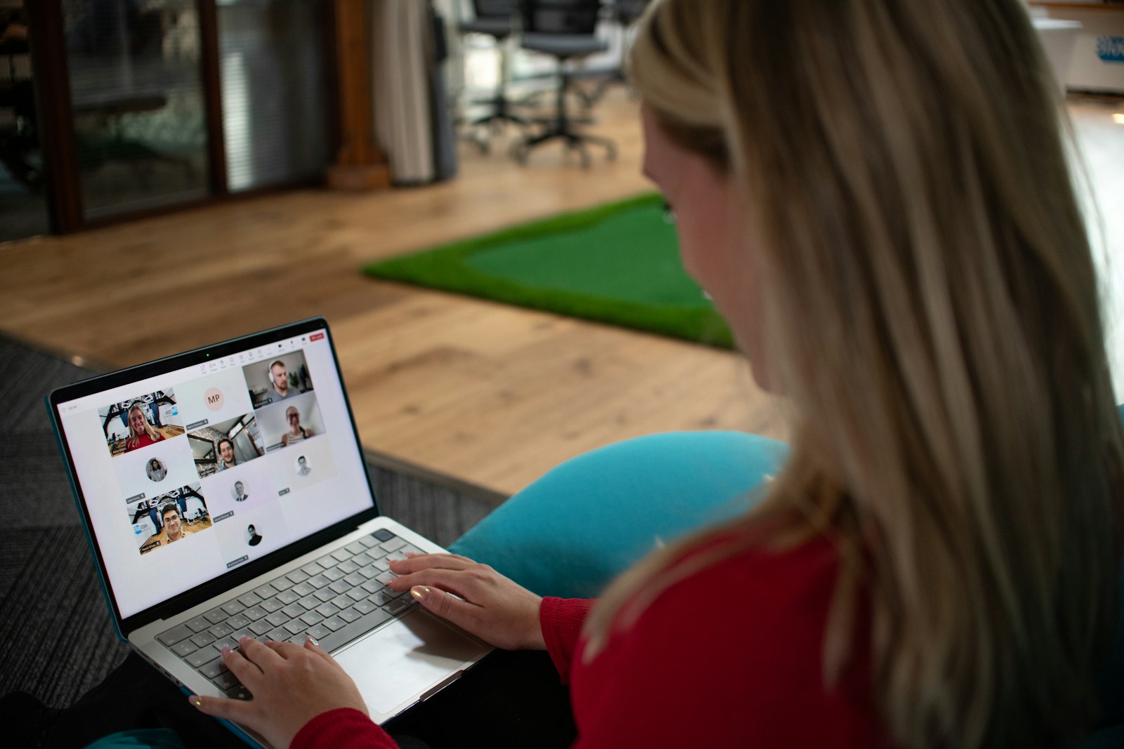 Remote worker joining a video meeting on a laptop